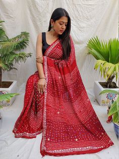 Gorgeous red colored dyed bandhani saree with mirror work Mirror Work Sarees, Saree With Mirror Work, Red Sarees, Kutch Gujarat, Bandhani Sarees, Mirror Work Saree, Bandhani Saree, Red Saree, Cheque Design