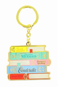 a keychain with books on it that says, the mermaid and canculla