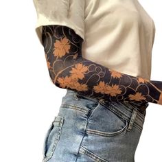 a person with a flower tattoo on their arm and hand is holding something in his other hand