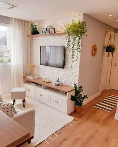 the living room is clean and ready to be used as a home office or entertainment center