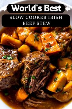 a bowl filled with beef and potatoes in gravy next to the words world's best slow cooker irish beef stew