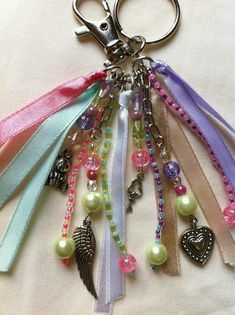 a keychain with lots of charms attached to it