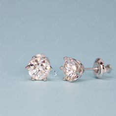 These simple yet stunning Moissanite stud earrings from The Silver Luna are the perfect diamond alternative gift. Moissanite gemstones sparkle with more fire and brilliance than mined diamonds, but at a fraction of the cost. Each earring features a 0. or 1 carat equivalent Moissanite gemstone set on solid 925 sterling silver bases. Whether you're shopping for an engagement gift, anniversary present or just looking to treat yourself, these Moissanite earrings provide dazzling beauty and lasting v Silver Lab Grown Diamond Earrings Gift, Gift Silver Lab Grown Diamond Earrings, Fine Jewelry Silver Earrings With Single Diamond, Sterling Silver Brilliant Cut Diamond White Earrings, Brilliant Cut Diamond White Sterling Silver Earrings, White Gold Moissanite Round Earrings, Moissanite Earrings With Diamond Accents For Gifts, Classic Silver Moissanite Earrings, Diamond White Single Diamond Sterling Silver Earrings