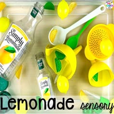 a tray with lemons, measuring spoons and bottles