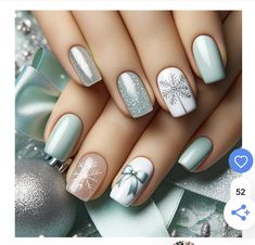 the nails are decorated with snowflakes and bows