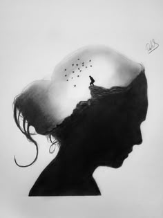 a black and white drawing of a woman's head with birds flying in the sky