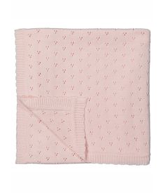 a pink blanket with small dots on it