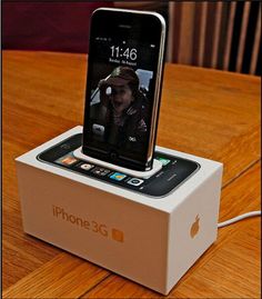 an iphone is sitting on top of a box