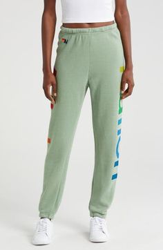 Rainbow-hued logos embolden these lounge-worthy sweatpants that have gone through an intense breaking-down process to give them a vintage feel you'll love. Elastic/drawstring waist Elastic cuffs 50% cotton, 38% polyester, 12% rayon Machine wash, tumble dry Made in the USA Athleisure Joggers With Logo Detail For Loungewear, Relaxed Fit Joggers With Logo For Loungewear, Athleisure Sweatpants With Logo For Loungewear, Casual Joggers With Logo For Loungewear, Casual Joggers With Logo Detail For Loungewear, Casual Loungewear Pants With Logo Detail, Green Sweats For Loungewear, Green Relaxed Fit Sweatpants For Lounging, Rainbow Logo