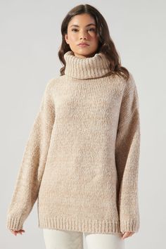 Cozy vibes in our chunky and comfy Salt and Pepper Tunic Sweater. Pair it with leggings and a beanie for a lazy day around the house.- Turtleneck sweater- Chunky marled yarn- Drop shoulder with volume sleeve- Tunic length- Comes in 2 colorsSize + Fit- Model is 5'10" and wearing size S- Measurements taken from size S- Chest: 46 1/2"- Length: 27"Fabric100% AcrylicStyle Number T9172ST Chunky Cream Turtleneck Sweater, How To Wear Turtleneck, Riddling Rack, Minimalistic Outfits, Turtleneck Tunic Sweater, Chunky Turtleneck Sweater, Women Turtleneck, Turtleneck Tunic, Womens Outfits