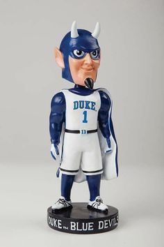 Blue Devil Bobblehead Duke Blue Devils In stock now! **Damaged Box - No Damage to Bobblehead** This is a full sized bobblehead made of high quality material that comes in a decorated box. Each bobblehead is hand painted with extreme attention to detail. Don't miss out on your opportunity to get this great bobblehead of Blue Devil. The bobblehead is officially licensed by the team and league. Please note that the box is damaged (crease, dings, etc.) but the bobblehead is in brand new condition. If you don't care about the box, this is a good opportunity to purchase this item at a discount. The box was just damaged in shipping. Duke Blue Devils Basketball, Duke Blue Devils, Duke University, Clothing Gifts, Blue Devil, College Basketball, Shop Fans, Bobble Head, Mlb Baseball