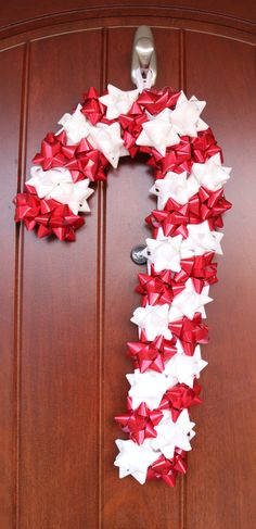 a door decorated with red and white bows