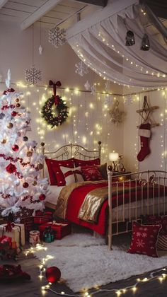 a bedroom decorated for christmas with a white tree