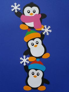 three penguins with hats and snowflakes on their heads