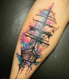 a watercolor painting style ship tattoo on the leg