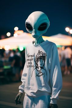 an alien is standing in the street wearing a sweatshirt that says normal people can't even come out