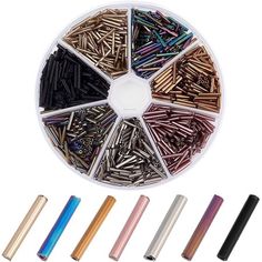 various colors and sizes of nails in a container