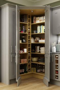 an open pantry with lots of items in the cupboards and shelves on both sides