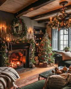 a living room decorated for christmas with fireplace and holiday decorations on the mantels