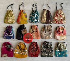 many different types of purses lined up on a table