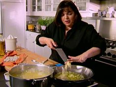 a woman is in the kitchen preparing food