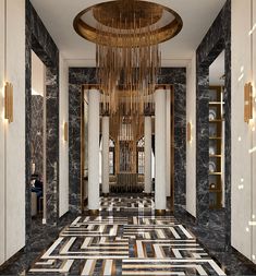 an elegant hallway with columns and chandelier