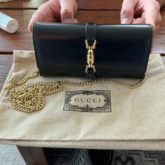 New, Never Worn. Purchased June 2023. Comes With Box And Dust Bag. Style 652681 14j0g 1000 The World Of Jackie 1961 Evolves With The Introduction Of A Continental Wallet With Delicate Chain Strap Allowing It To Be Worn As A Mini Bag. The Gold-Toned Piston Detail Pays Homage To The Original Bag. Here, The Accessory Is Presented In Black Leather. Black Leather Gold-Toned Hardware Viscose Lining Piston Detail 12 Card Slots And Two Bill Compartments, Two Separate Interior Compartments And Zip Coin P Gucci Jackie 1961, Pocket Chain, Chain Wallet, Delicate Chain, Original Bags, Bag Style, Wallet Chain, 7 H, Chain Strap