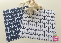 two bags with anchors and starfish on them, one is blue and the other is white