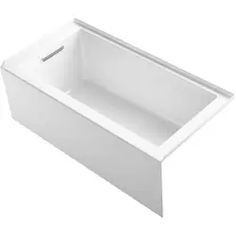 the bathtub is white and has a long, rectangular tub with an overflowing drain