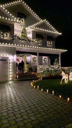 a house decorated with christmas lights and decorations