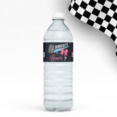 a bottle of water sitting next to a checkered flag