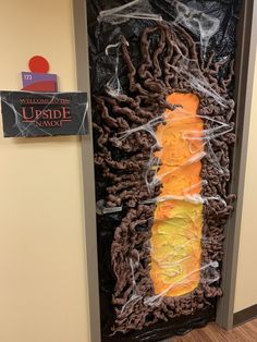 the door is decorated with fake food and plastic wrap around it's edges for halloween