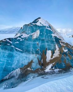 a large mountain covered in snow and ice