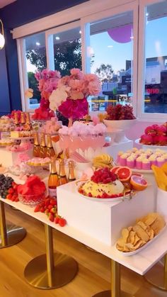 a table filled with lots of desserts and pastries