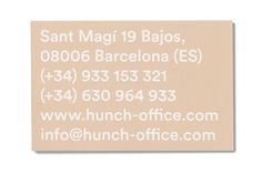 a business card with the words lunch - office com in white ink on it, and an image of santa magi'19 bajos, 0806 barcelona es