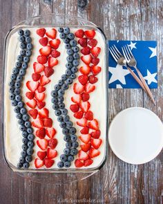 an american flag cake with berries, blueberries and strawberries in the shape of usa