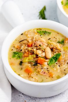 a white bowl filled with soup on top of a table