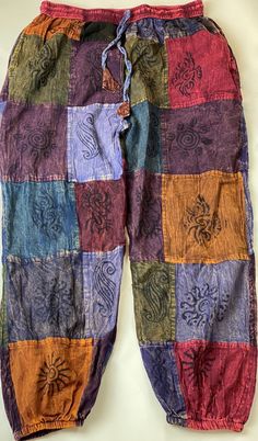 multicolored patchwork pants with drawstrings on the bottom and side