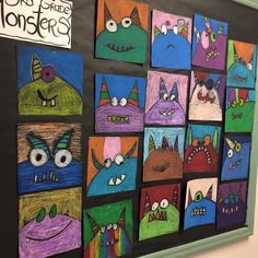 a bulletin board with monsters painted on it