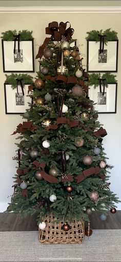 a christmas tree decorated with ornaments and ribbons