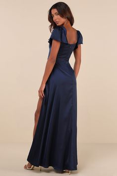 There's no reason not to feel your best when you have a look like the Lulus Ultimate Sweetness Navy Blue Satin Flutter Sleeve Maxi Dress! You'll feel absolutely fabulous the moment you slip into this luxe satin dress that features a flattering princess-seamed bodice, a trendy square neckline, and short flutter sleeves (with hidden no-slip strips at the shoulders). The high, fitted waist tops a flowy, A-line skirt that falls to a sweeping maxi hem with an alluring side slit. Hidden back zipper/clasp. Fit: This garment fits true to size. Length: Floor length. Size medium measures 61.50" from shoulder to hem. Bust: Great for any cup size. Waist: Fitted - very fitted at natural waist. Hip: Not Fitted - fuller skirt allows room for hips. Undergarments: May be worn with any standard bra. Fabric: Deep Navy Bridesmaid Dresses, Plus Prom Dresses Plus Size, Winter Semi Formal Dresses Long, Prom Dress Thick Straps, Elegant Blue Prom Dress, Dark Dusty Blue Dress, Wedding Guest Dress Flowy, Modest Winter Formal Dresses, Winfo Dresses Long