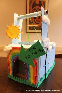 a cardboard box that has been made to look like a castle with a rainbow painted on it