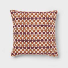 an orange and white checkered pillow