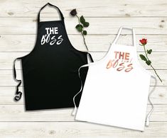 two aprons with the boss and the boss printed on them next to each other