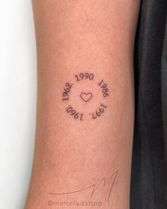 a woman's leg with a tattoo on it that reads, the year 1950 - 1970