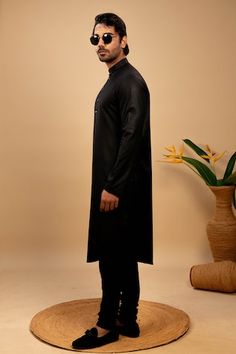 Black asymmetric hemline silk kurta. Paired with a churidar. - Aza Fashions Black Cotton Silk Fitted Kurta, Black Fitted Cotton Silk Kurta, Fitted Cotton Silk Kurta For Formal Occasions, Formal Fitted Cotton Silk Kurta, Fitted Cotton Traditional Wear For Semi-formal Occasions, Fitted Cotton Semi-formal Traditional Wear, Black Fitted Silk Kurta, Fitted Cotton Silk Kurta For Eid, Eid Cotton Silk Fitted Kurta