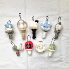 crocheted ornaments are arranged on a white sheet