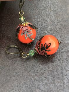 Orange Boho Earrings, Bohemian Earrings, Autumn colors, Fall Dangle Earrings, Leaves Earrings, Handmade Jewelry, Gift Ideas for her, women Hello, This is a handmade item made by myself. I love these,, they are very unique and beautiful. They make a perfect handmade gift for any occasion. Color : Orange Finish : Acrylic bead, hand-painted metal Size : Approximately 1.75 inches with the lever back ear wires included. Ear wires : antiqued bronze lever back ear wires The earrings will arrive in a co Vintage Orange Dangle Earrings, Orange Metal Earrings As A Gift, Orange Beaded Vintage Earrings, Orange Metal Earrings As Gift, Vintage Orange Beaded Earrings, Orange Vintage Earrings For Gift, Vintage Orange Earrings For Gift, Vintage Orange Pierced Earrings, Unique Orange Round Earrings