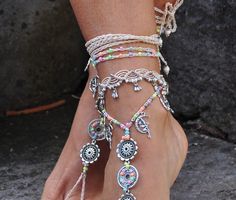 This listing is for one anklet. Beautiful macrame anklet. You can wear it alone or in combination with the barefoot sandals available in my shop (picture 2, 3 and 7) https://www.etsy.com/listing/509547430/silver-fairy-mandala-barefoot-sandals?ga_search_query=silver+fairy&ref=shop_items_search_2 This anklet is made with waxed polyester cord, tibetan silver beads and charms and czech seed beads. They close with a lobster claw and on the other side a small chain allows to adjust the length of t Handmade White Bohemian Barefoot Sandals, White Handmade Bohemian Barefoot Sandals, White Bohemian Handmade Barefoot Sandals, White Bohemian Toe Ring Barefoot Sandals, White Bohemian Barefoot Toe Ring Sandals, Adjustable Bracelets For Summer Weddings, White Bohemian Barefoot Sandals With Ankle Wrap, Adjustable Spiritual Anklet For Festival, White Festival Jewelry