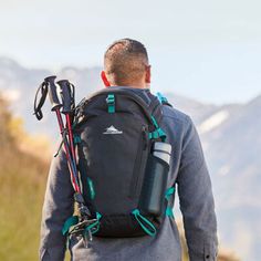 a man with a backpack and skis on his back